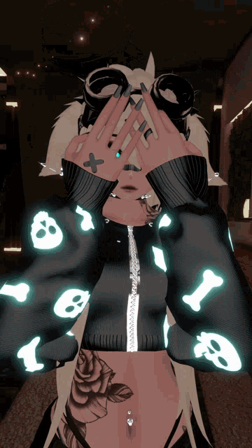 a girl wearing a black jacket with skulls and bones on it covering her eyes