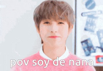 a young man in a pink sweater is making a funny face and says pov soy de nana .