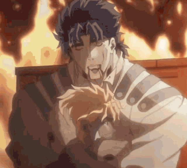 a man is standing in front of a fire and holding a child in his arms .