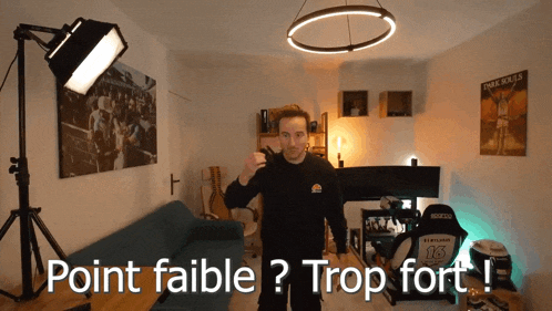 a man stands in a room with the words point faible trop fort on the bottom
