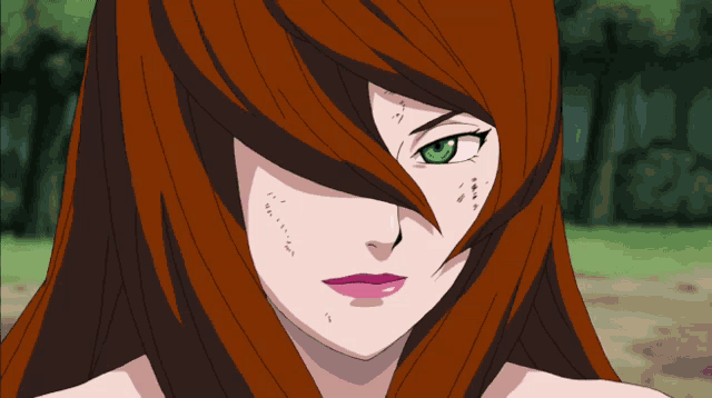 a woman with red hair and green eyes has a few spots on her face