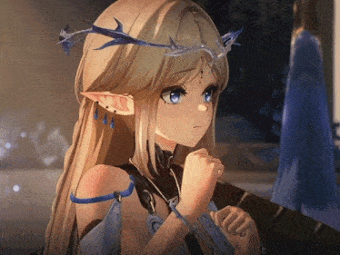 a girl with blonde hair and blue eyes is wearing a crown