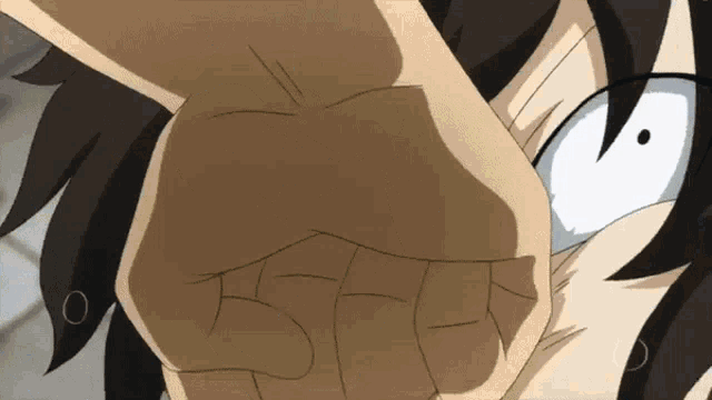 a close up of a person 's fist with a surprised expression on their face