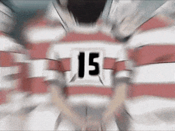 a blurred image of a person wearing a number 15 jersey