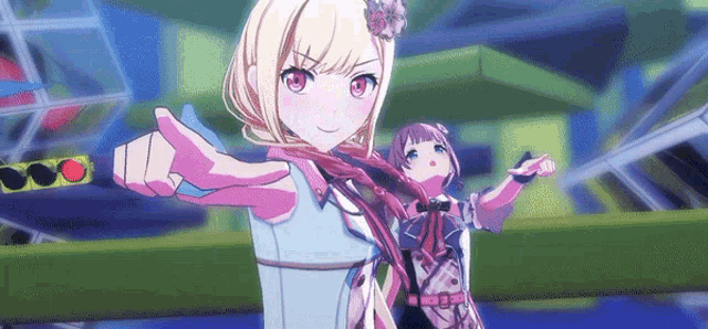 a couple of anime girls are standing next to each other .