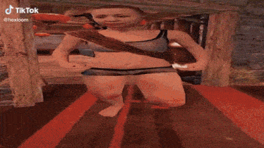 a person in a bikini is walking in a video game ..