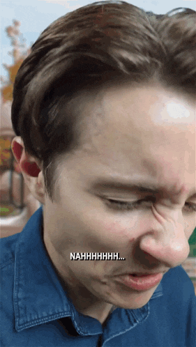 a close up of a man 's face with the words nahhhhhhh written on the bottom