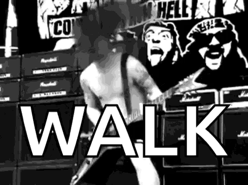 a black and white photo of a man playing a guitar with the words walk in white letters