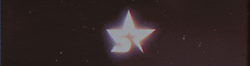 a star with the letter s on it is glowing in the dark