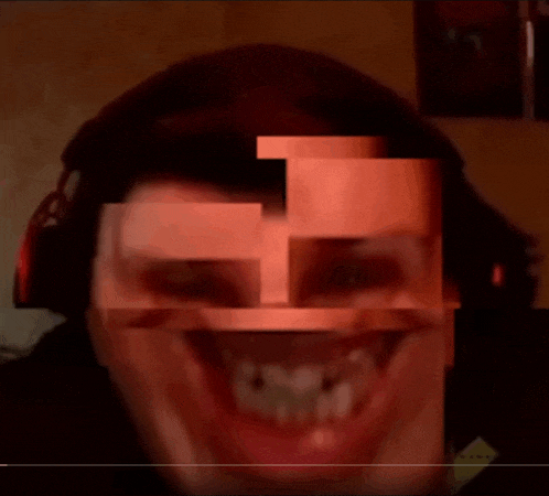 a blurry picture of a man 's face with a triangle in the middle