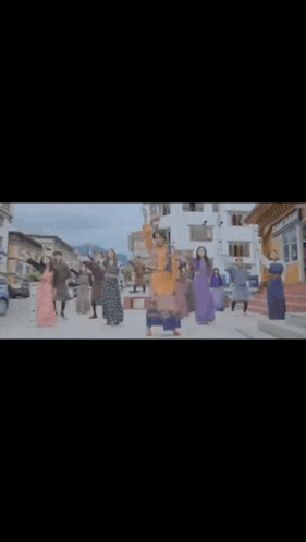a woman is dancing in a crowd of people .