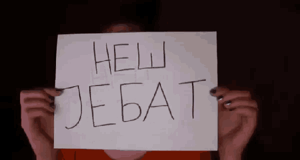 a person is holding a piece of paper that says hell jebat