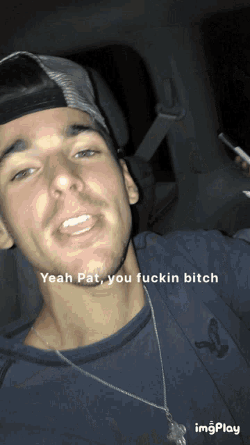 a man wearing a hat and a necklace says yeah pat you fuckin bitch on the bottom