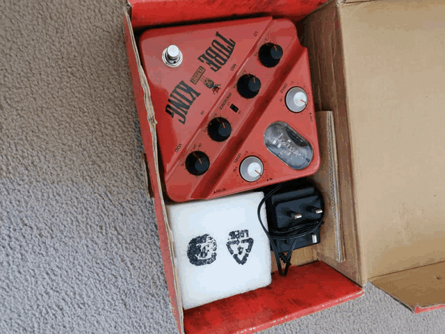 a tube king guitar amplifier in a cardboard box