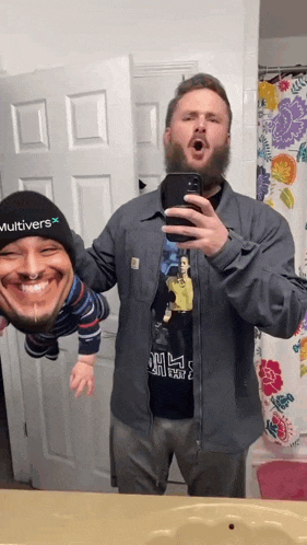 a man wearing a hat that says multivers holds a baby