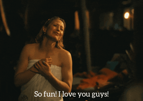 a woman wrapped in a white towel says so fun i love you guys