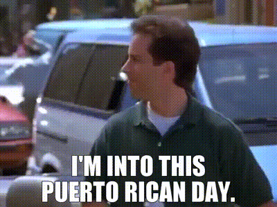 a man in a green shirt is saying i 'm into this puerto rican day ..