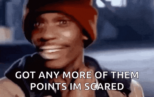 a man wearing a red beanie is smiling and says `` got any more of them points im scared '' .