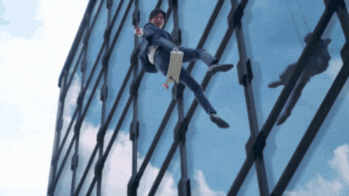 a man in a suit is falling off a building