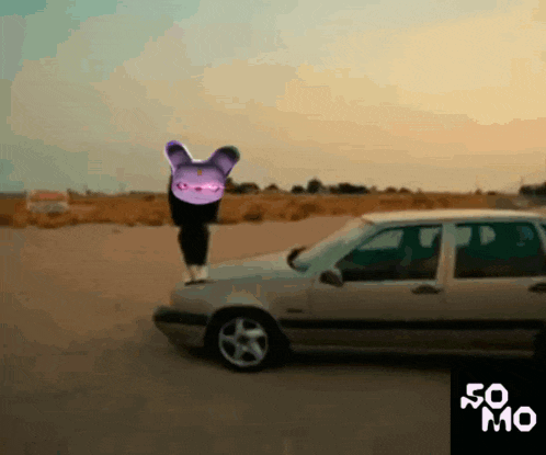 a person standing on top of a car with a purple rabbit on their head