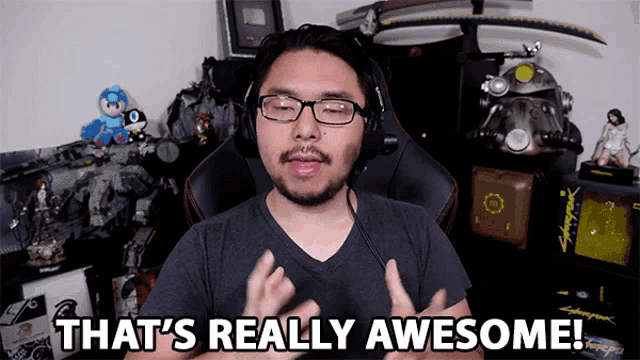 a man says that 's really awesome while wearing headphones and glasses