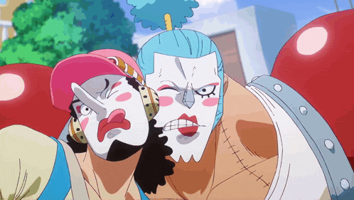 a couple of cartoon characters with their faces painted
