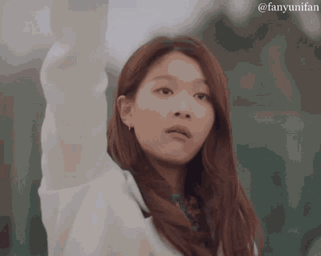 a close up of a woman 's face with the hashtag @fanyunifan on the bottom