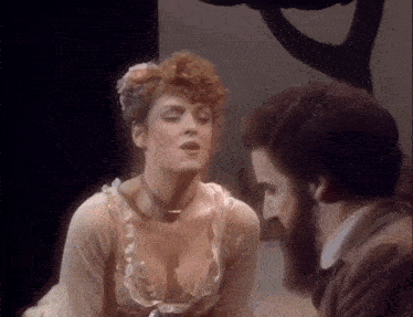 a man and a woman are talking to each other