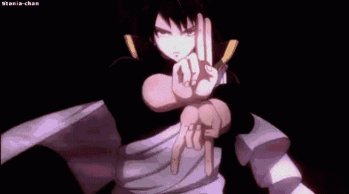a close up of a person 's face with red eyes making a peace sign .