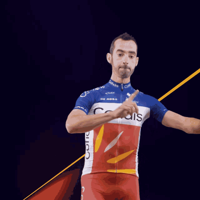 a man wearing a blue and white cofidis jersey