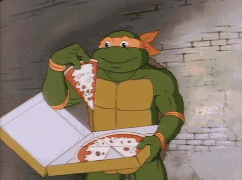 a cartoon turtle is holding a box of pizza and eating a slice .