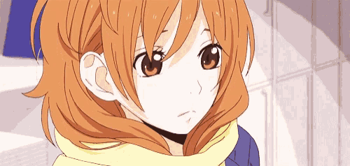 a close up of a girl with orange hair wearing a yellow scarf