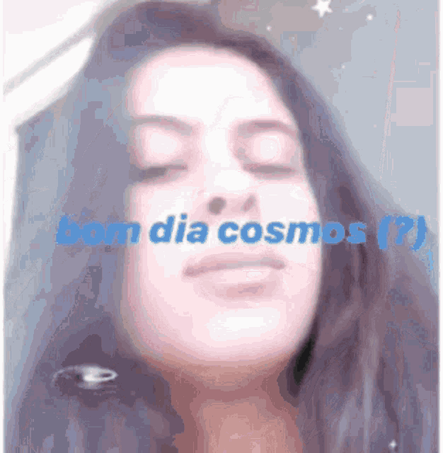 a close up of a woman 's face with the words bom dia cosmos written above her .