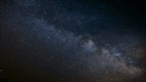 a paper airplane is flying through the night sky