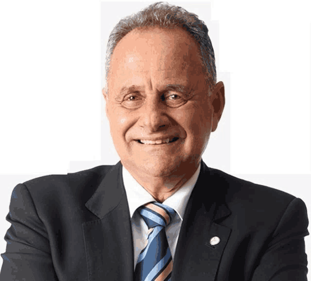 a man in a suit and tie is smiling and looking at the camera