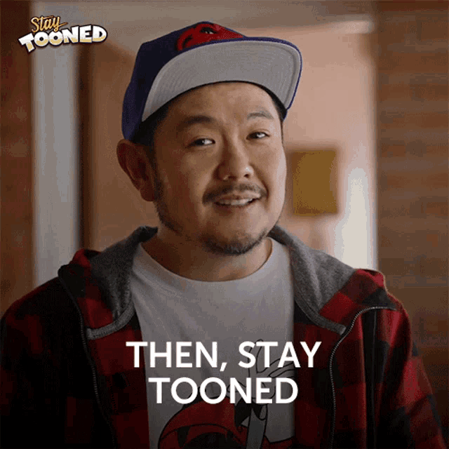 a man wearing a hat and a plaid jacket with the words then stay tooned below him