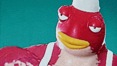 a close up of a cartoon character wearing a chef 's hat and a red shirt