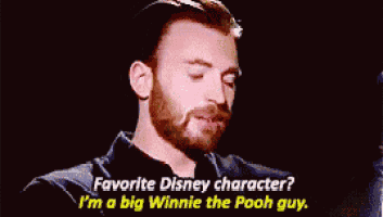 a man with a beard is talking about his favorite disney character . he is a big winnie the pooh guy .