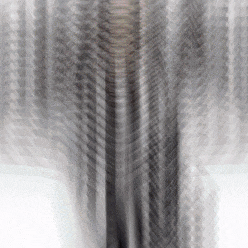 a blurred image of a person standing in a room