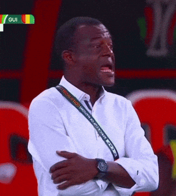 a man with a lanyard around his neck that says ' africa cup of nations '