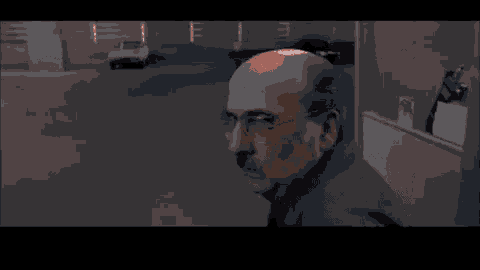 a man in a wheelchair is surrounded by fire .