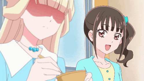 two anime girls are standing next to each other one is holding a bowl