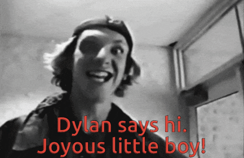 a black and white photo of a boy with the words dylan says hi joyous little boy