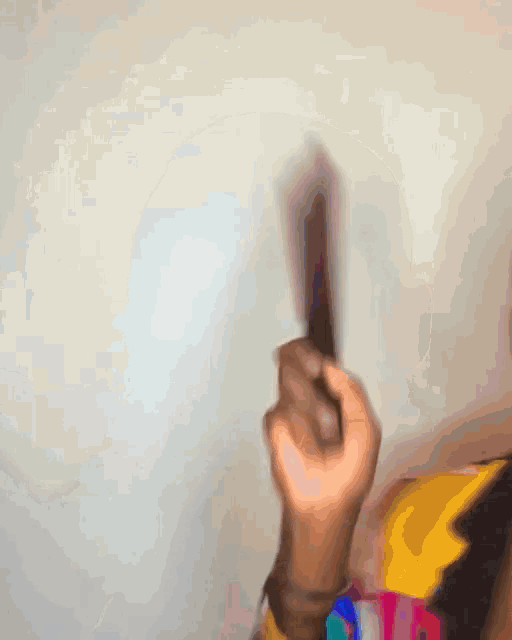 a blurry picture of a person 's hand reaching out