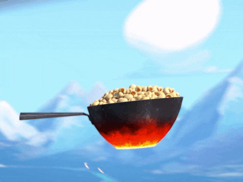 a frying pan filled with popcorn is floating in the air