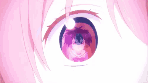 a close up of a person 's eye with a reflection of a person 's face .