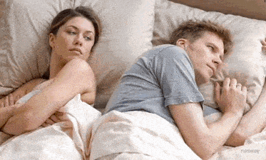 a man and a woman are laying back to back on a bed with the word runway on the bottom right