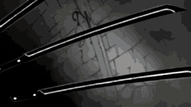 a pair of scissors against a brick wall