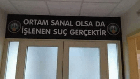 a sign above a door that says ortam sanal olsa da islenen suc gerçektir