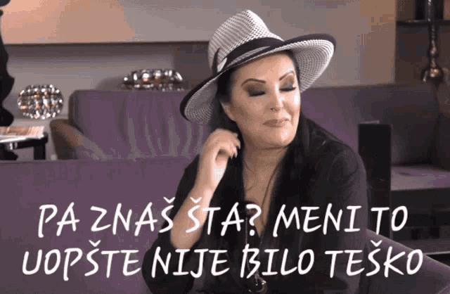 a woman wearing a hat is sitting on a purple couch with the words pa znas sta written above her